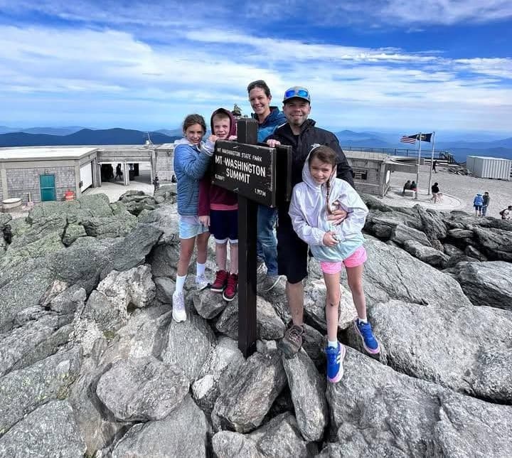 Brian Chesney with his wife and three children at the Mount Washington summit.