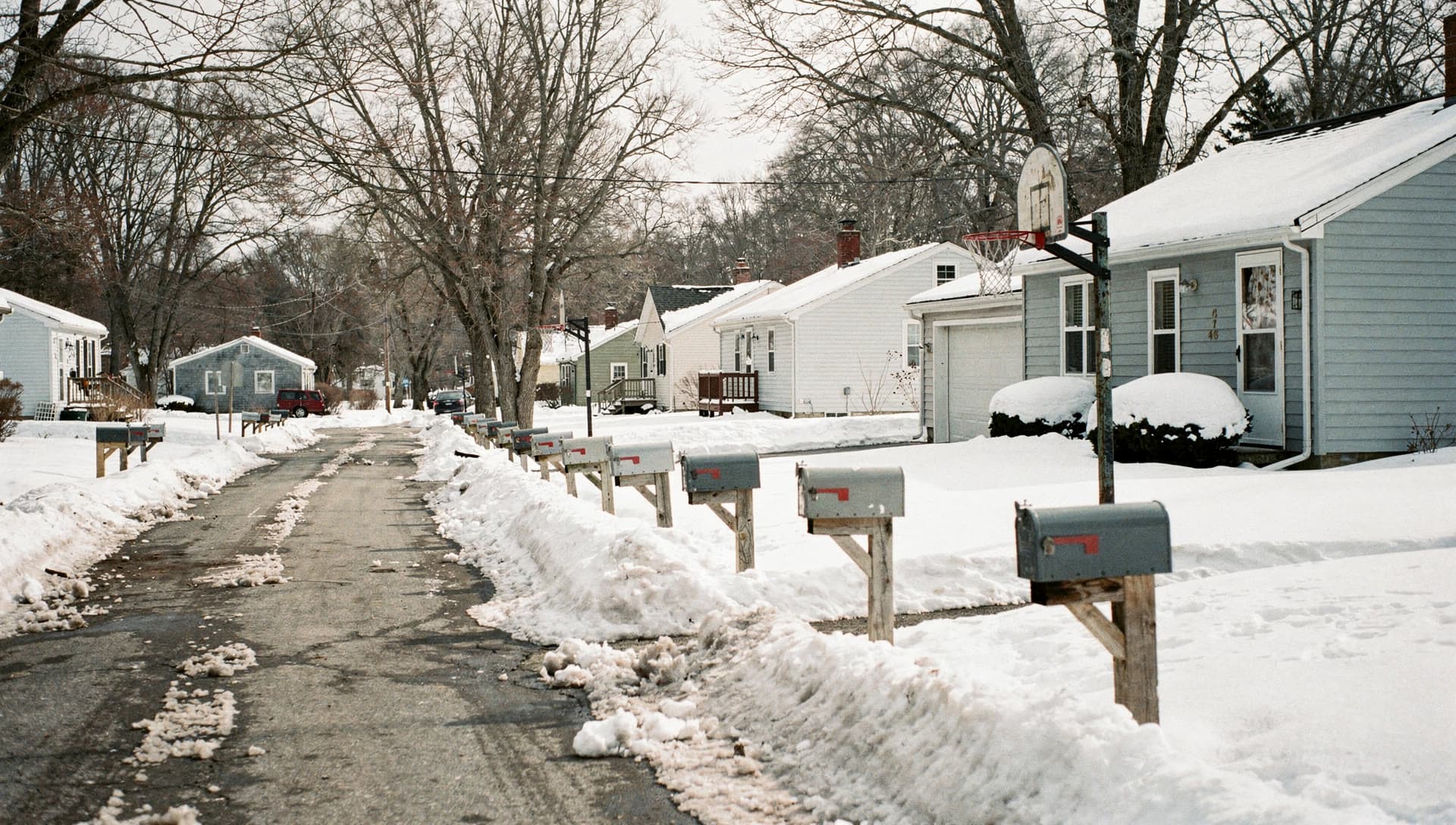 A residential street in Salem, NH in winter.