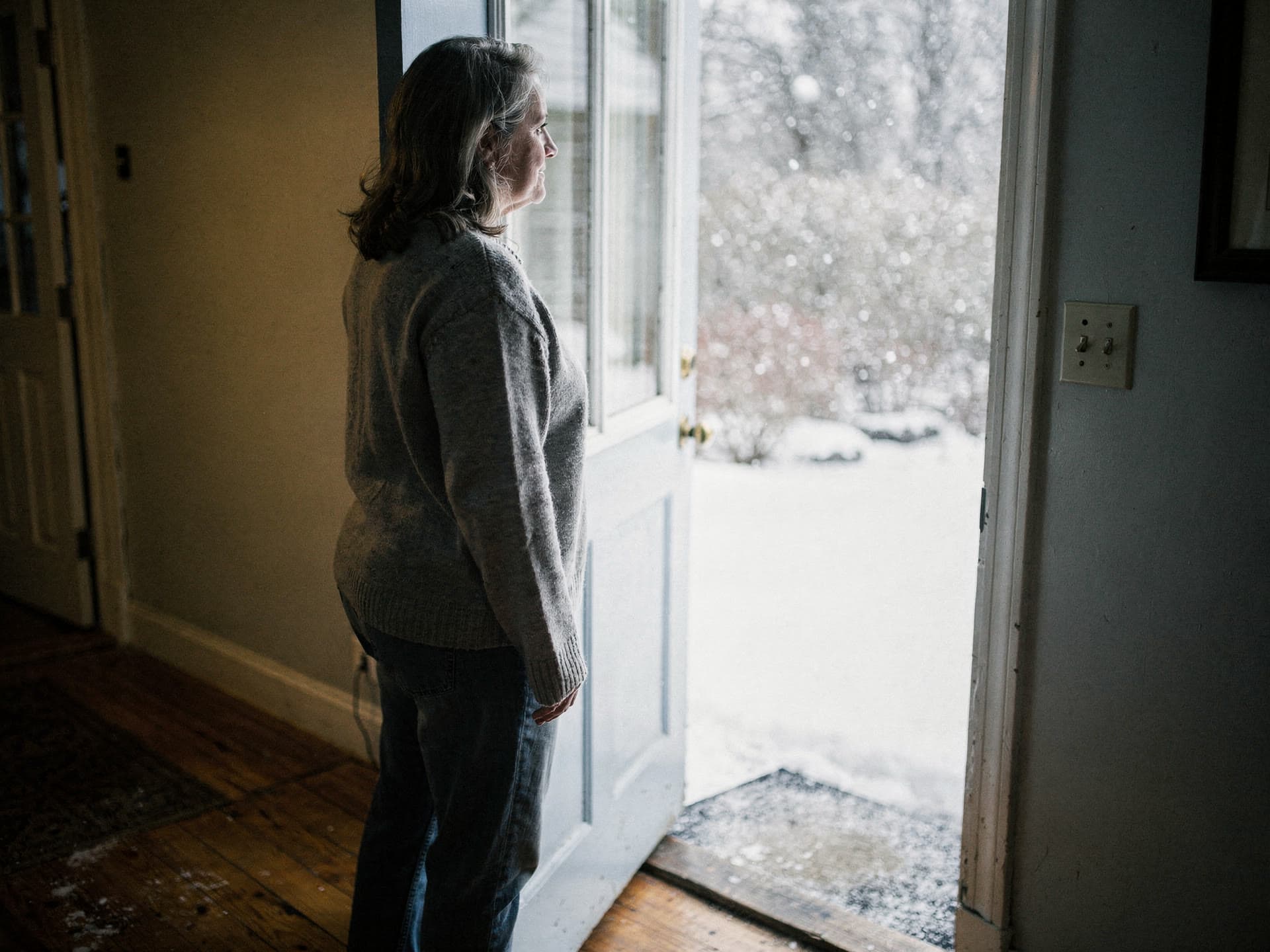 A southern New Hampshire homeowner talking with her technician on her own front step